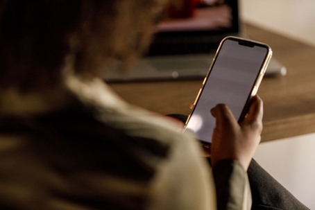 woman scrolling on phone