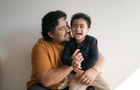father and son hugging